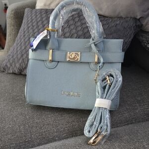 Bebe Light Blue Satchel with Gold Accents And Crossbody Strap.